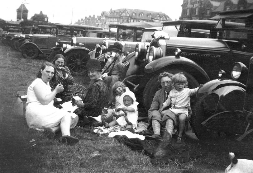 A family outing to Skegness, Lincolnshire, taken about 1925. My mother is the little girl in the centre holding her baby brother. My other uncle is on my grandfather's lap. My grandmother is in the spotted dress, next to my grandfather's sister, with my great grandmothers completing the group. My grandfather worked for a fruiterer, and also drove his boss around in his car, and was allowed to borrow it on occasions.

