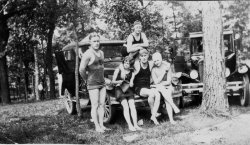 The grandparents passed this photo on to me.  It is almost certainly taken in the Michigan lower peninsula. I'm still researching who the people are and I guess the date to be early 1920s.  One wonders what the guy in the background is up to. View full size.
(ShorpyBlog, Member Gallery)