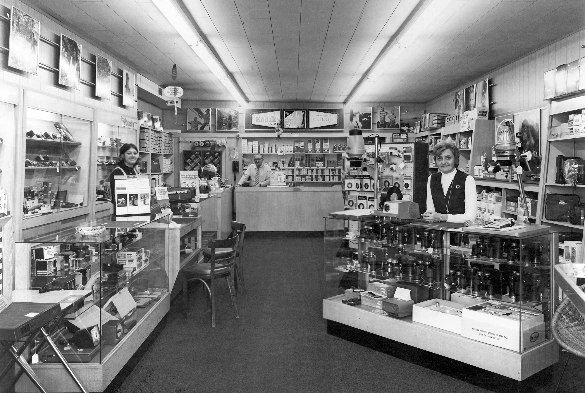 The Wayne Camera Center circa 1970s in the Preakness Shopping Center, Wayne, NJ.  I believe that's the founder, Bill Orkulsky, who started the store in 1955.  Not sure if the ladies present are his wife and daughter or just employees.  Lots of future "collectibles" and "kitsch" for sale. View full size.
