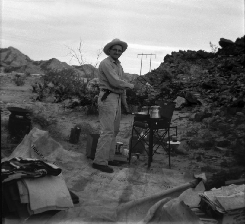 This is my great grandpa out camping. It looks like he's cooking up a steak on the Coleman stove. I don't know the location but I'd guess it's somewhere in the deserts of California. This was taken sometime in the '50s. View full size.
Scanned from a Kodak safety negative.
