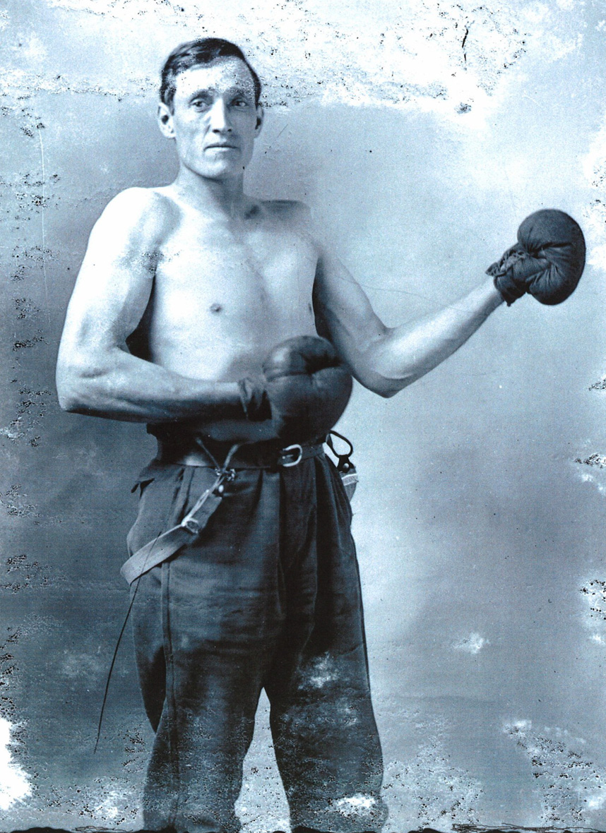 This is my great-grandfather, Gilbert Carroll Weimer, circa 1910. He lived in Garrett County, Maryland and my great aunt told me that boxing was a major pastime in those days. The men would make a boxing ring in town and gather to display their skills. View full size.