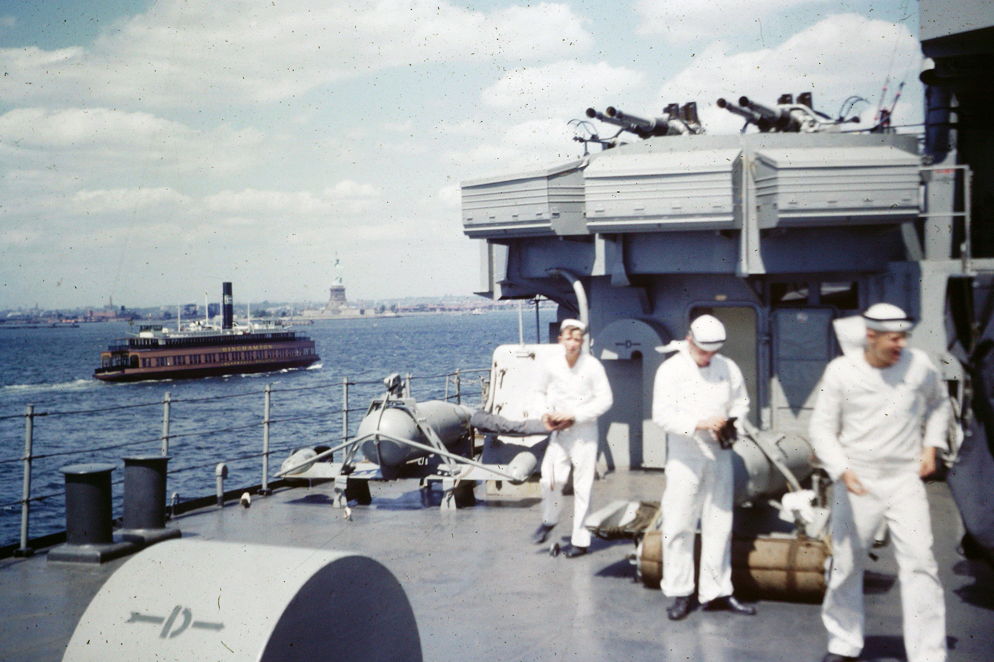 Returning from or going to Korea, 1952, with the Statue of Liberty in the background. View full size.