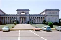 The Palace of the Legion of Honor in San Francisco, circa 1958. If I'm not mistaken, that is our blue &amp; white 1956 Ford station wagon on the right. View full size. 
VertigoIf you look very closely, you can just make out Jimmy Stewart stalking Kim Novak.
T-BirdNote the '57 Ford Thunderbird in the rare Coral Sand color with white top.  To us right is a '55 Ford wagon and then a '52 Ford.  At left is a '56 Plymouth.
Bird &amp; WagonWas the coral color really rare for T-Birds? I seem to remember seeing them all over the place in Southern California in the 1960s, and quite a few even in the late 90s and early 2000s.
I agree that the wagon looks like a 1955 rather than 1956. They look much alike, but I think the 1956s had a chrome ring around the inner part of the tail light.
(ShorpyBlog, Member Gallery)
