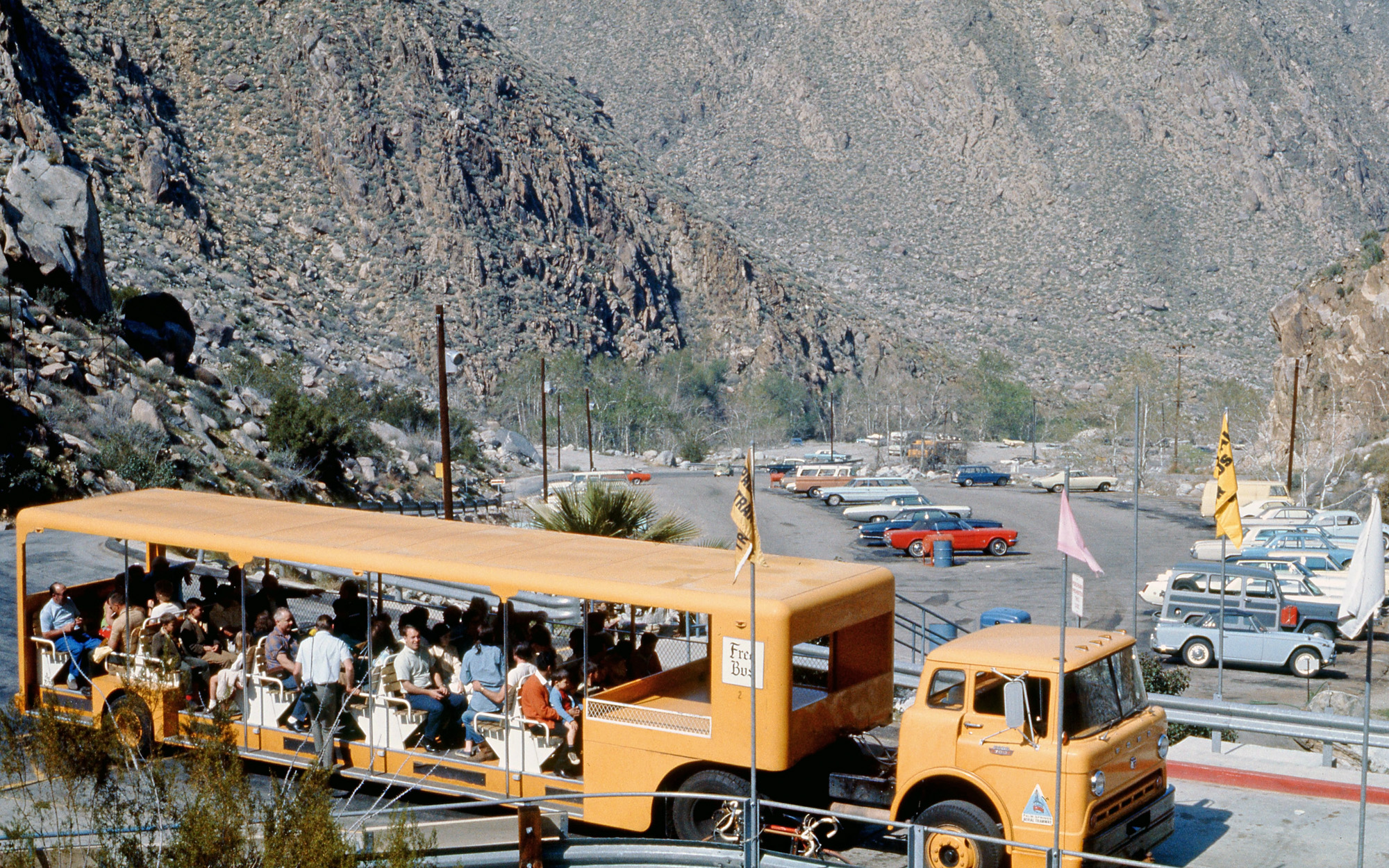 Palm Springs, California, March 1969. The tractor-trailer shuttle between the lower parking lot and aerial tram base entry. I wonder if this unique vehicle has survived. View full size.