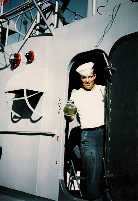 My grandfather George "Jack" Rudes on his ship during WWII, preparing to brew some coffee for his fellow sailors.