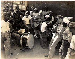 My grandfather George "Jack" Rudes (center, with guitar). He was a really great guy who loved music. He mainly played bass but and here he is playing with some of the men he was stationed with in the Philippines during WWII.