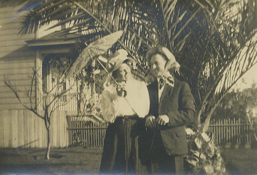 Another one from my Instant Relatives collection.  They look like such a fun loving couple.  He must be quite taken with her to be wearing "that" on his head.  Had to consult my Fashions of Yesteryear expert on when this was taken and we determined it to be from the Edwardian period.  Am assuming it was shot in Southern CA (due to the palm tree in the background & that's where I obtained the pic), but don't know much else about this one... any thoughts out there?  Thanx!
