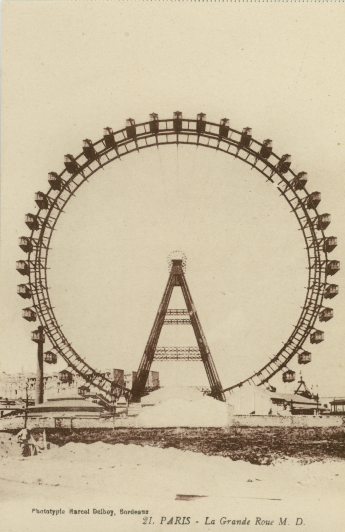 Look closely at the cars on the Ferris Wheel.  They're huge--like small train cars almost--exactly what I imagined the cars on the original Ferris Wheel looked like at the 1893 World's Fair in Chicago.  This Ferris Wheel appears to have been located in Paris, according to the writing on the bottom of the photo.  I can't be absolutely positive, obviously (if anyone just so happens to be sure of the location, please let me know).  According to my estimation (some of the cars are obscured by the building at the bottom), it even has 36 cars, like the original Ferris Wheel.

I read in The Devil In The White City (a fantastic book by Erik Larson) that each of the cars on the original Ferris Wheel weighed 13 tons, bringing the total to about 1 million tons.