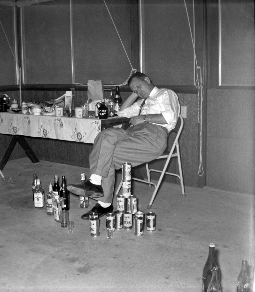This was taken in the mid '50s in my great grandparent's patio. This was a friend of theirs supposedly passed out with cans and bottles placed around him as a joke. I think this is a staged photo because there's another with my great grandpa like this as well but I could be wrong. Scanned from a Kodak safety negative. View full size.