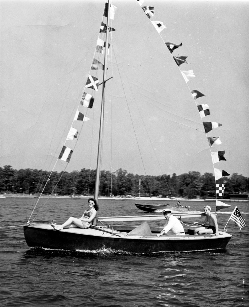 Summer vacation on the Metedeconk River, NJ, always meant a boat parade on the 4th of July. This was taken in 1941, five months before the attack on Pearl Harbor. Our lives changed that year. Dad was busy building ships for the U.S. Navy, I went on to college and the young man steering the "Patsy Anne" finished high school and enlisted in the US Maritime Service (Merchant Marine). We married 50 years later and are living happily ever after. View full size.
