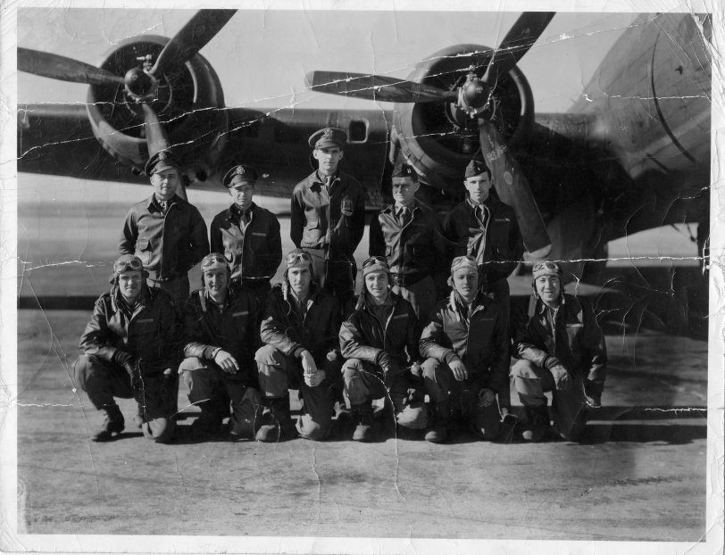 Shared by JimEichholz: My great uncle Paul Salk (kneeling 2nd from left) together with the rest of his bomber crew in front of their B-17.  He was a tail-gunner.  Later he moved to a B-29, and unfortunately died in a rendezvous accident with another B-29. Photo was taken in early 40s. View full size.