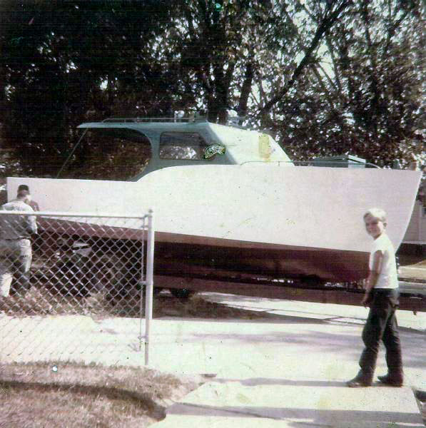 The Peggy Lou was a 26-foot steel cabin cruiser that my Dad, Bill (standing with his back to the camera), built in our backyard. That is my brother Michael looking back at the camera, and looking forward to some fishing on Lake Erie no doubt. Toledo, Ohio, c. 1960. View full size.