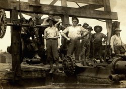 I think this photo was taken at one of the family sawmills in Mississippi in the early 1900s. I'm not sure what the equipment is for, but it sure looks impressive. View full size.
Probably an oil drillThe equipment in this photo does not resemble any kind of sawmill configuration. Note the pipe in the background and the wooden superstructure. This is likely an oil rig. Drilling in the state began in 1903 and resulted in more than 400 dry holes in the 36 years afterward. The first discovery of oil in Mississippi occurred in 1939 near Jackson. 
(ShorpyBlog, Member Gallery)