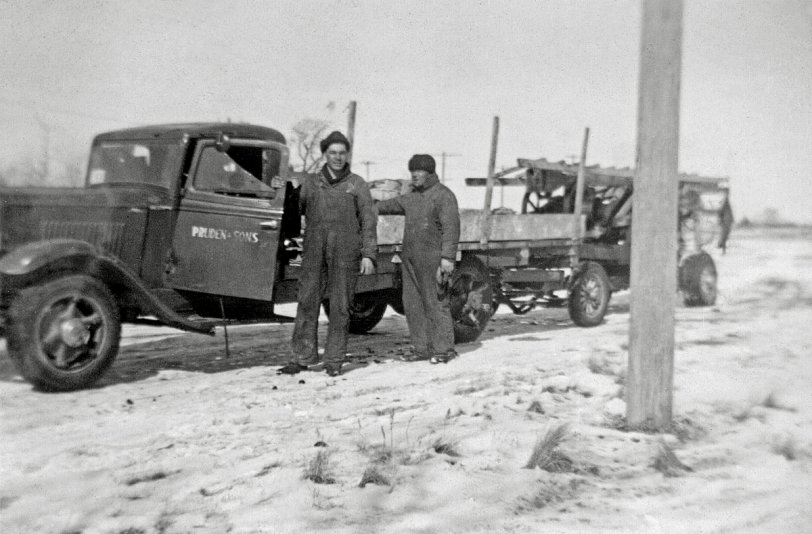 Pruden and Sons water well drilling contractors taken in 1944 Manitoba Canada. Early 30's International truck towing a "Red Devil" percussion drilling machine. View full size.
