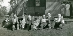 A bizarre alternative to the "all stand against a wall while I shoot you" approach to taking a group photograph. While the guys are all stretched out on the lawn, the gals seem to be huddled together in the background for their own activity. This is from a photo album put together by a high school teenager during the years 1918-1921. I bought the album at an ephemera meet in Pasadena California. View full size.
(ShorpyBlog, Member Gallery)