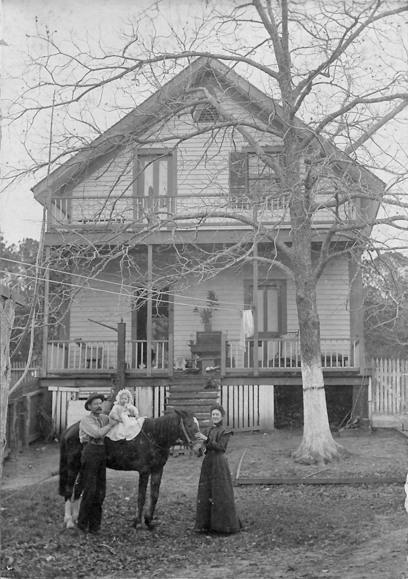 1109 S. Pascagoula St. backyard about 1910. Leo Rohr, holding baby, was the town blacksmith. 
