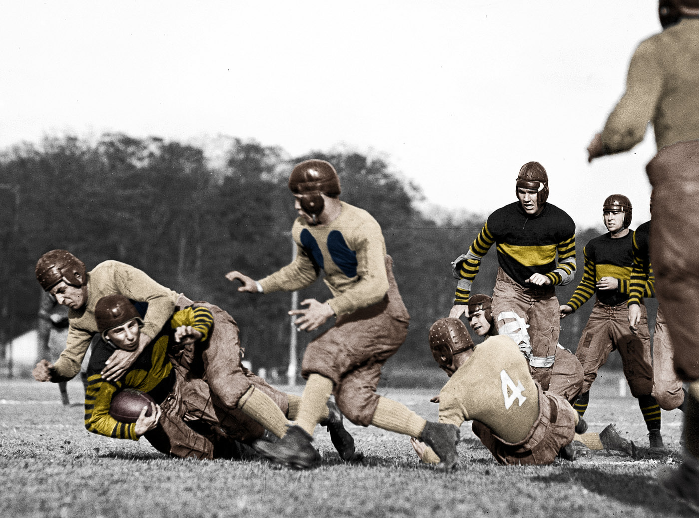Colorized version of "Old-School: 1923." I could not find any information as to which team wore which uniforms or what the colors were back then so I took the modern colors for each school and assigned them as I saw fit.

Randolph-Macon currently has Lemon Gold and Black so I assigned those colors to the team with the dark jerseys with the stripes.

Gallaudet has Blue and Buff which I assigned to the team with the light jerseys and the dark chest panels. View full size.