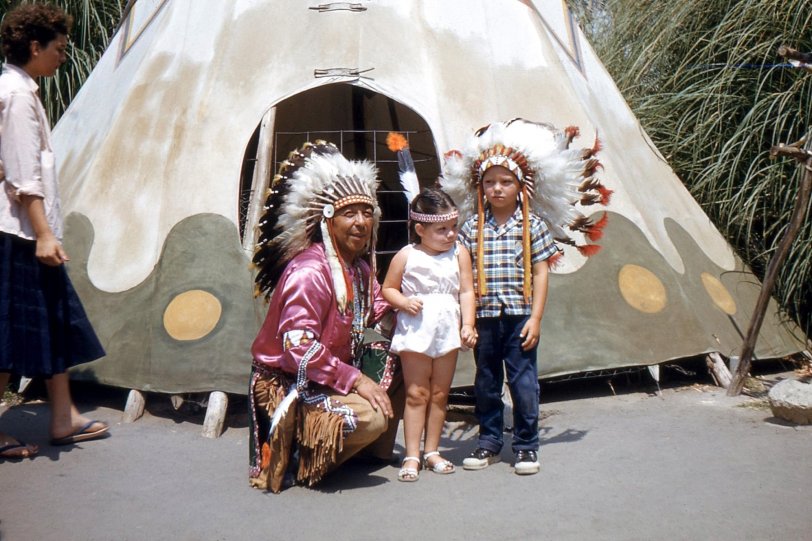 Visiting the Indian Village at Knott's Berry Farm, Buena Park, California in 1959. Cousin Pat and his little sister aren't so sure about the whole 'living village' concept. 35mm Kodachrome slide. View full size.
