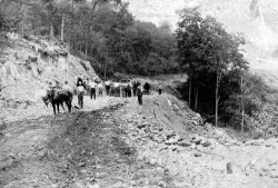 Somewhere in this photo of the process of building the highway around the face of Storm King Mountain in about 1912, is my dad's teenage half uncle, Clayton C. MacNeal. Once part of US Highway 9-W linking West Point to Cornwall-on-Hudson New York, it is now called NY 218, and driving it today is a rather thrilling experience, but the views of the Mid-Hudson River valley from there are as spectacular as ever. View full size.
(ShorpyBlog, Member Gallery)