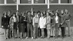 "The Rockin' Sounds,' a contemporary music vocal/instrumental group, Rogers High School, Rogers, Arkansas, 1971. View full size.
FloodsBell bottoms, elephant pants: there were many names for the type of pants worn by the lanky fellow on the far right.  But because of the great distance between the bottom of his trousers and the ground, we would have considered these pants fit to withstand rising flood waters.  My goodness, kids could be mean.  As further proof, the former kid in me points out the haughty look on the face of the young lady beside floods boy.
(ShorpyBlog, Member Gallery)