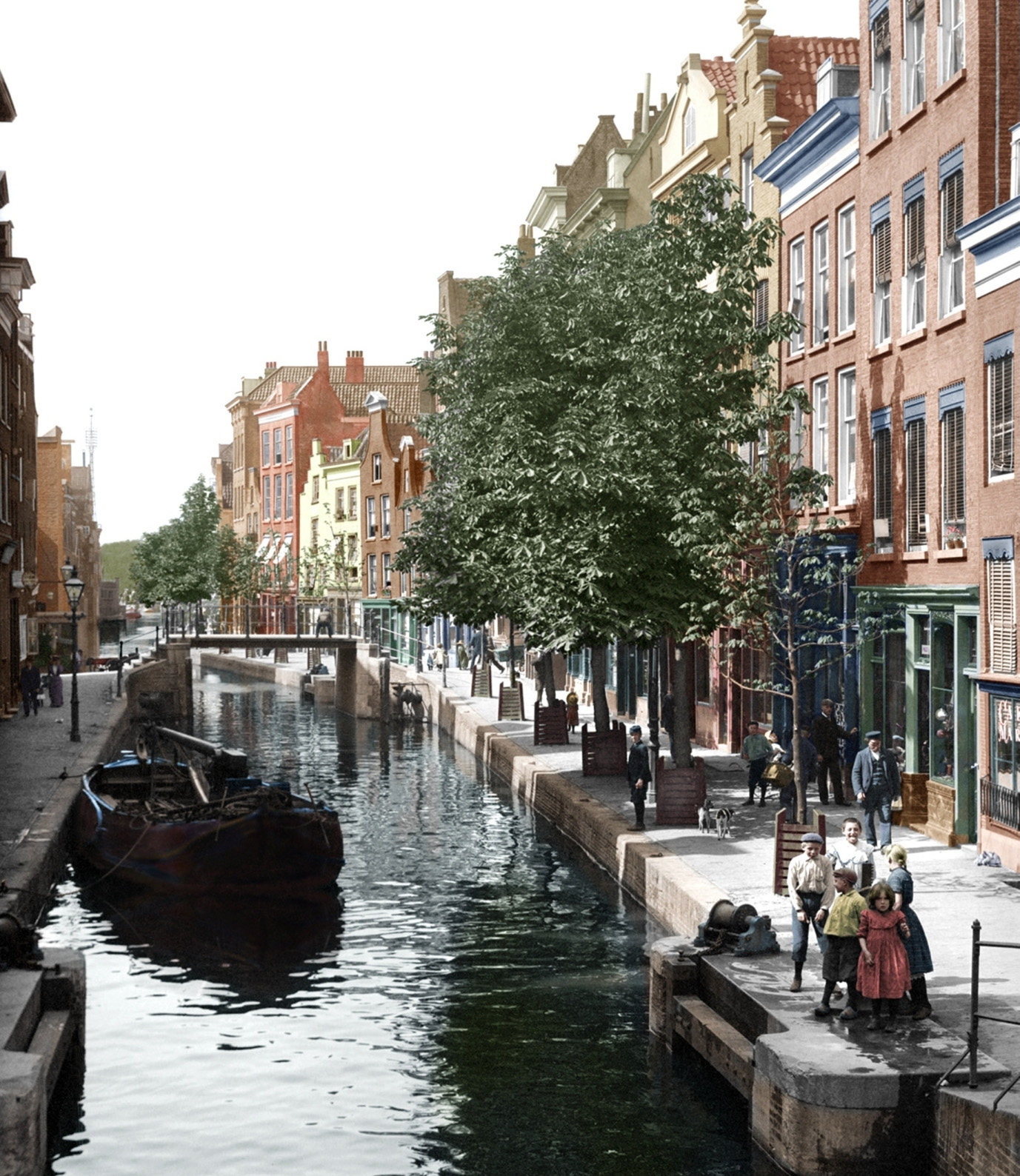 Colorized version of Spuiwaterboot Canal in Rotterdam as seen from a bridge. One of a series of images taken in Europe in 1904 by an unknown photographer. (There is some disagreement regarding the location of this canal but a great photo never the less). View full size.