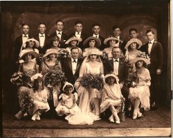 This photo shows the wedding party of my great-grandparents Robert Vanella to Sadie Faranda in New York City, 1920 or 21. The best man (sitting to the bride's left) is one John Torrio. He was said to be my great-grandfather's cousin and was definitely his "business associate." Vanella, also know as Roxy Vanelli owned and operated Vanella Funeral Chapel at 27-29 Madison Street in Manhattan. The funeral home still stands and is operated by distant relatives of mine.  View full size.
(ShorpyBlog, Member Gallery)