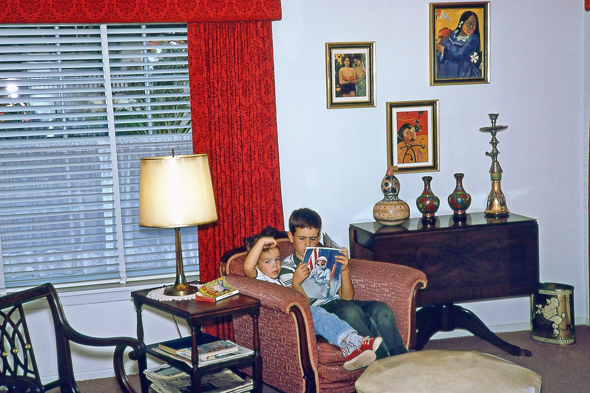 This was taken by my dad almost certainly on the last weekend in January, 1967. Not only am I reading a book about astronauts with my little bro, but the newspaper on the side table is the L.A. Times. By zooming in, the headline appears to be: "3 Astronauts Killed in Apollo Test. " I was such a follower of the space program, and this photo just renews the sense of tragedy I felt. View full size.