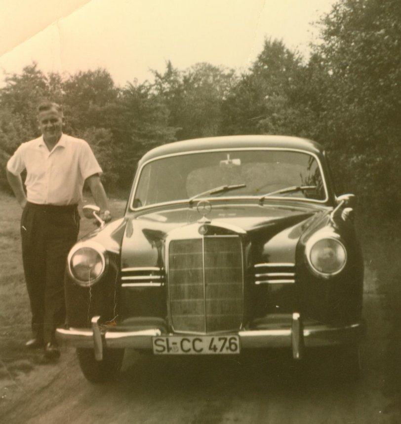 Siegen, Germany, 1955. My father-in-law with a Mercedes 180D.
