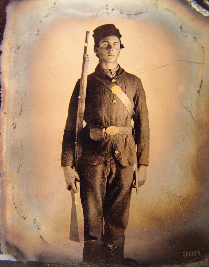 1861-65. "Soldier in Union uniform and cap box standing with musket and bayonet with scabbard." Sixth-plate tintype, hand-colored, removed from frame. Liljen&shy;quist Collection of Civil War Photographs, Library of Congress. View full size.
