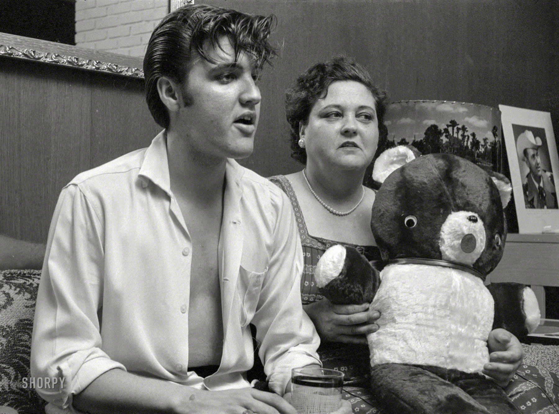 May 1956. Memphis, Tennessee. "Elvis Presley at home with his mother, Gladys." 35mm negative from photos by Philip Harrington for the Look magazine assignment "Elvis Presley -- He Can't Be, but He Is." View full size.