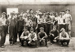 August 1908. "Noon hour in an Indianapolis tomato cannery. Young fellows in front of boxcar." Photograph by Lewis Wickes Hine. View full size.