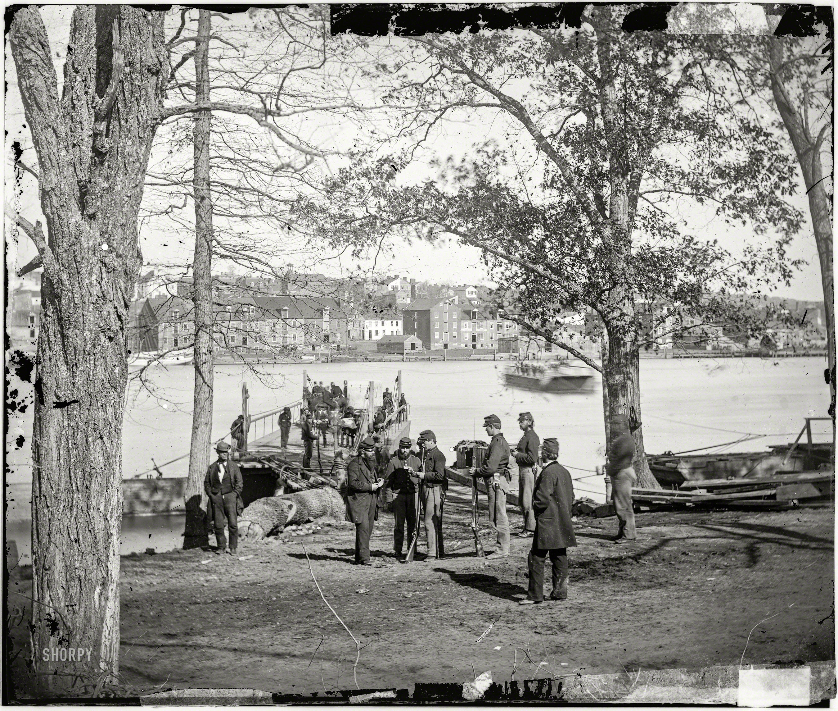 Washington, D.C., circa 1861. "Guards at ferry landing on Mason's Island examining a pass." Wet plate glass negative by George N. Barnard. View full size.