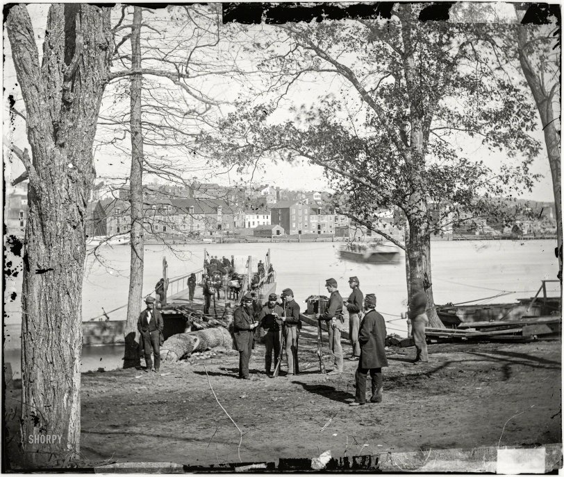 Washington, D.C., circa 1861. "Guards at ferry landing on Mason's Island examining a pass." Wet plate glass negative by George N. Barnard. View full size.
