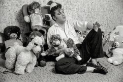 May 1956. Memphis, Tennessee. "Elvis Presley at home with stuffed animals." 35mm negative from photos by Phillip Harrington for the Look magazine assignment "Elvis Presley -- He Can't Be -- But He Is." View full size.
