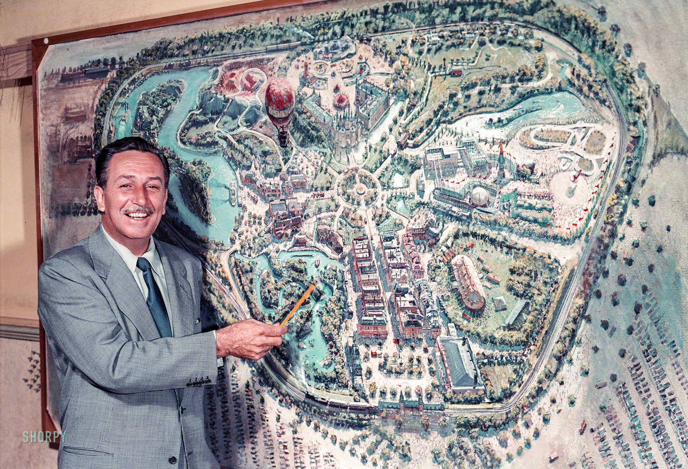 July 1954. Los Angeles. "Walt Disney pointing to a plan for Disneyland, under construction in Anaheim." Color transparency from photos for the Look magazine assignment "Here's your first view of Disneyland." View full size.