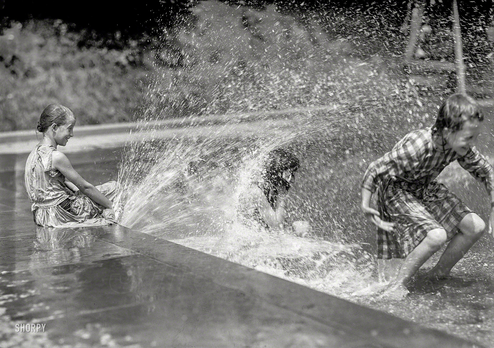 Summer 1912. "District of Columbia parks. Children at fountains and pools." Harris & Ewing Collection glass negative. View full size.