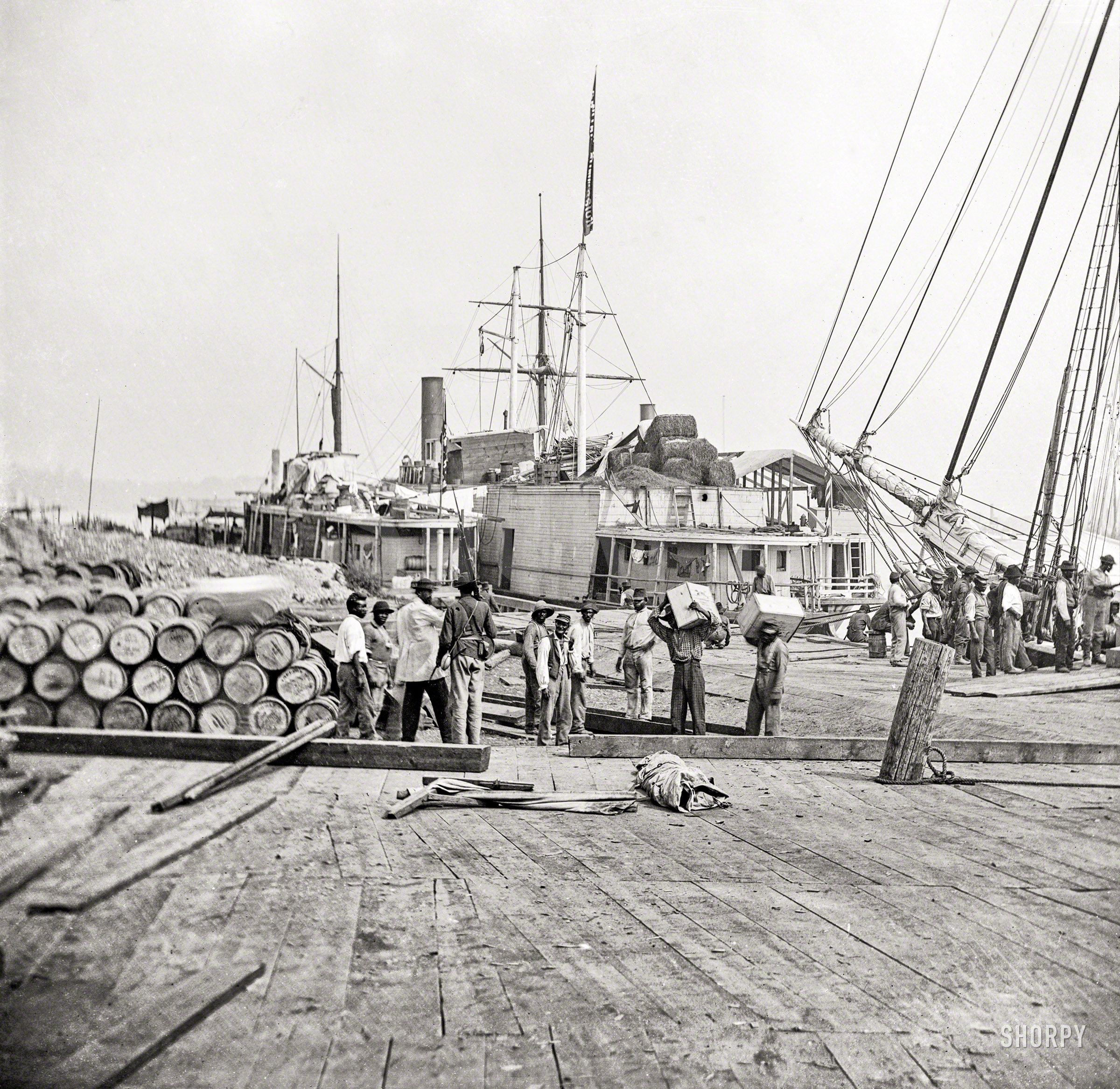 "City Point, Virginia. Federal headquarters during the Siege of Petersburg, 1864-65. Unloading vessels at landing." Wet plate glass negative. View full size.