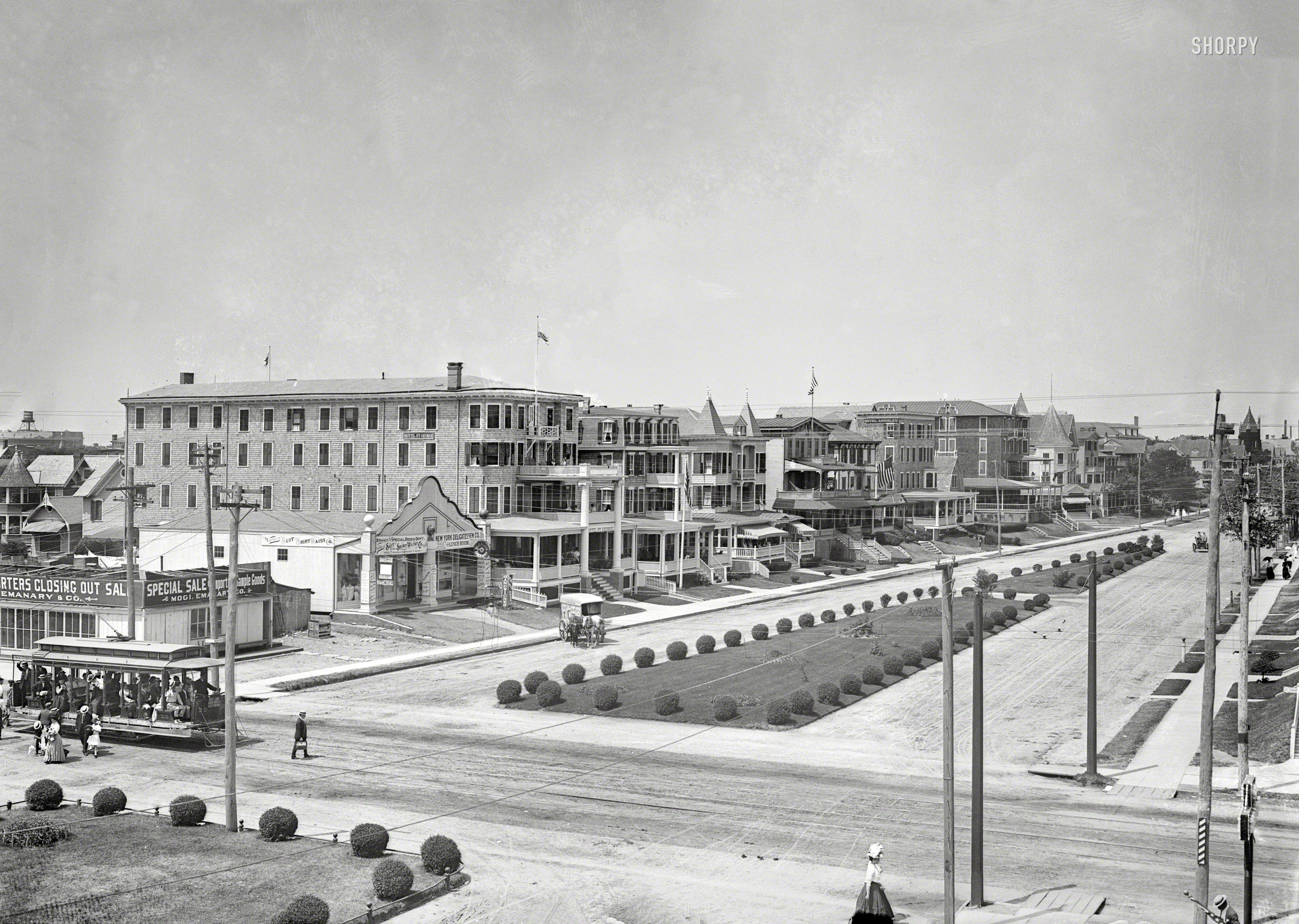 July 1911. "Street scene, 2nd Avenue, Asbury Park." Greetings from this pleasant setting for the ice wagon, streetcar, sandwich shop and resort hotels. 5x7 glass negative, George Grantham Bain Collection. View full size.