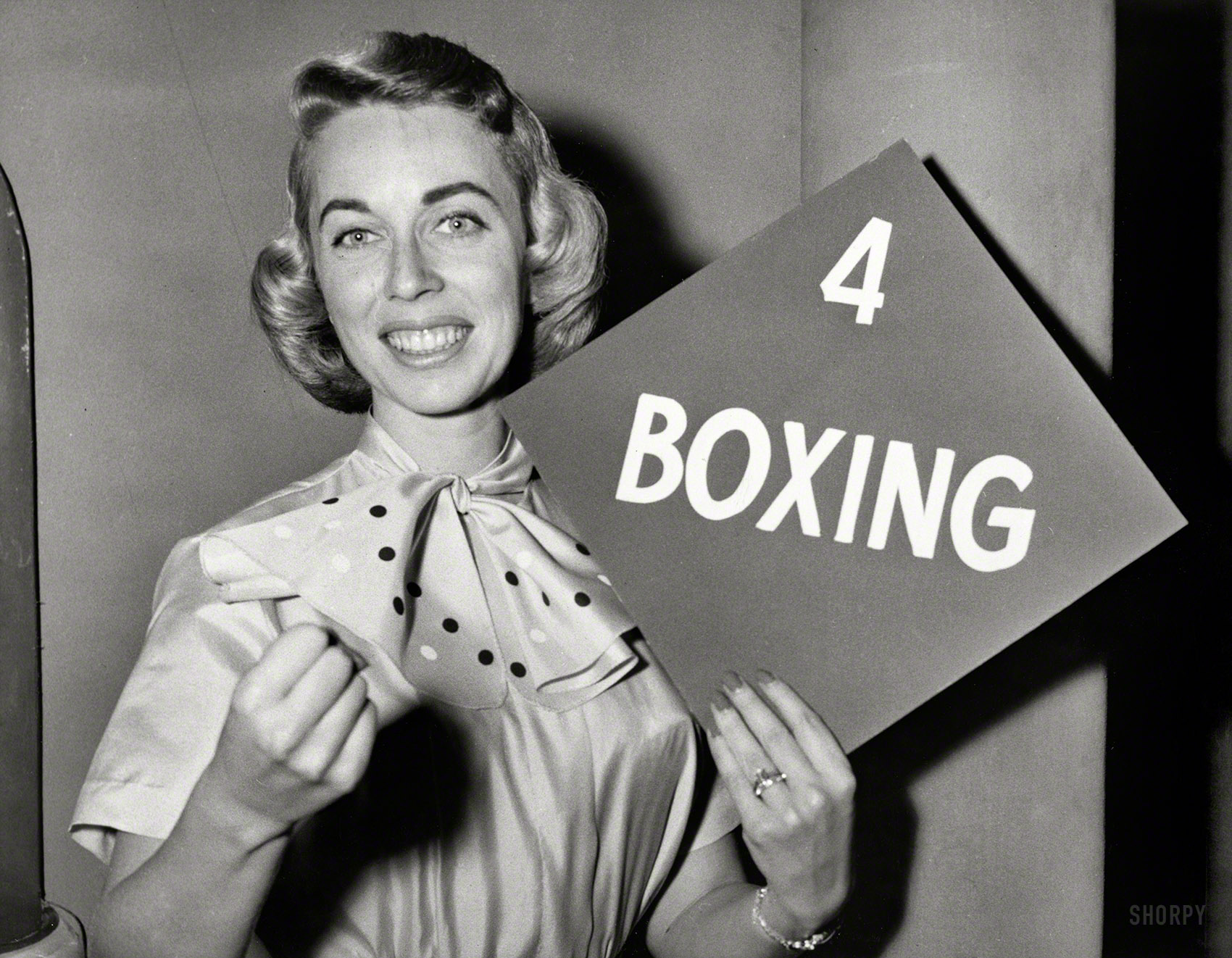 Nov. 15, 1955. "Dr. Joyce Brothers holds up her category, boxing, after winning $8,000 on the CBS television program The $64,000 Question. Dr. Brothers will return next week to decide whether to keep the $8,000 or risk it against $16,000." New York World-Telegram and Sun Photo Collection. View full size.