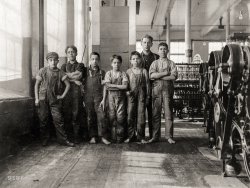 January 1912. Fall River, Mass. "In this group are some of the youngest workers in Spinning Room of Cornell Mill. The smallest is Jo Benevidos, 5 Merion Street. Other small ones are: John Sousa, 84 Boutwell St.; Anthony Valentin, 203 Pitman St.; Manuel Perry, 124 Everett St.; John Travaresm [Taveresm?], 90 Cash St. The difficulty they had in writing their names was pathetic. When I asked the second hand in charge of the room to let the boys go outside a moment and let me get a snap-shot, he objected, saying they would stay out and not be in shape to work. When they carry dinners, they breathe the close air of the spinning room from 7 a.m. to 5:30 p.m. with no let-up." Photo by Lewis Wickes Hine. View full size.