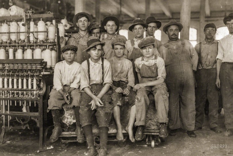 November 1913. West, Texas. "Some of the younger boys working in Brazos Valley Cotton Mills at West. One, Charlie Lott, was 13 years old according to Family Record. Another, Norman Vaughn, apparently 12 years old, was under legal age according to one of the boys there, Calvin Caughlin, who did not appear to be 15 years old himself. These and two girls that I proved to be under legal age were all working in this small mill. It was an exceptional case, but it is likely that as the children become tired of school later in the year, there will be many more at work." Photo and caption by Lewis Wickes Hine. View full size.
