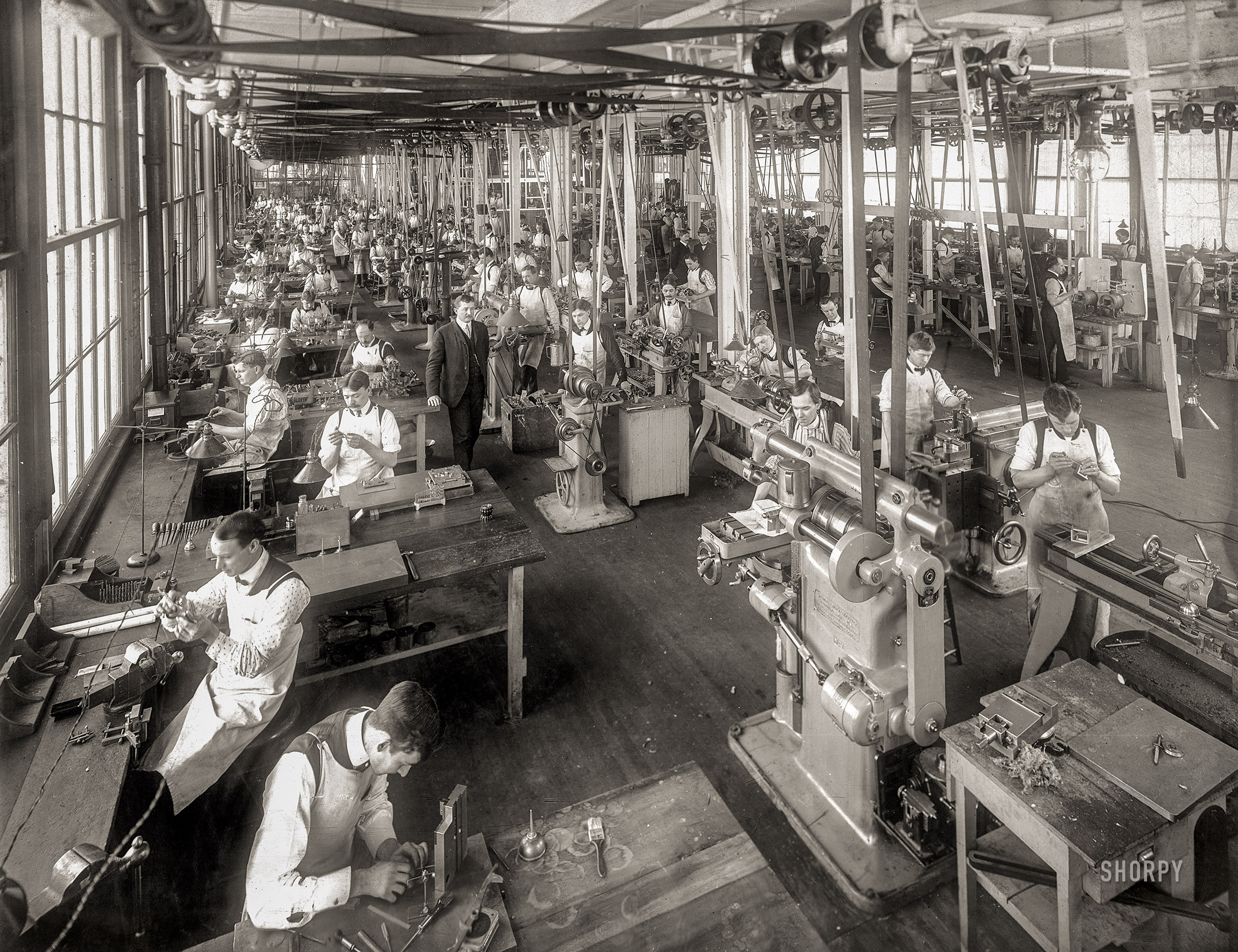 Dayton, Ohio, 1904. "Tool room of the National Cash Register Co." A case study in belt-and-pulley power transmission. George R. Lawrence Co. photo. View full size.