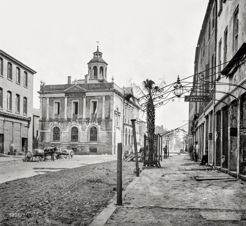 April 1865. Charleston, South Carolina. "Post Office (old Exchange and Custom House), East Bay Street, showing the only Palmetto tree there is in the city." Wet plate negative by George Barnard, from photographs of the Federal Navy and sea&shy;borne expeditions against the Atlantic Coast of the Confederacy. View full size.
