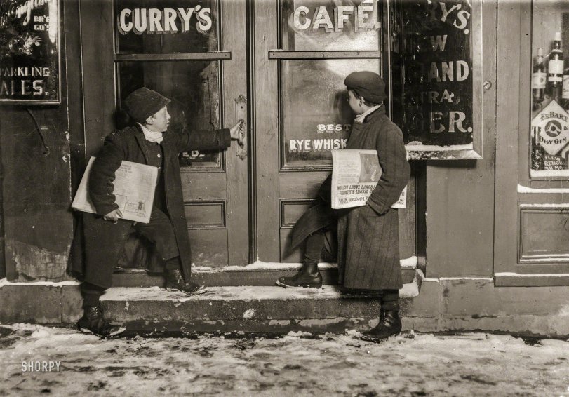 March 1909. Hartford, Connecticut. "9:30 P.M. A common case of 'team work.' Smaller boy (Joseph Bishop) goes into saloon and sells his last papers. Then comes out and his brother gives him more. Joseph said, 'Drunks are me best customers. I sell more'n me brudder does. Dey buy me out so I kin go home.' He sells every afternoon and night. Extra late Saturday. At it again at 6 A.M. Sunday." Photo by Lewis Wickes Hine for the National Child Labor Committee. View full size.
