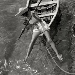 1938. "Swimwear model on bow of skiff at Marineland." You've come a long way, baby. Medium format negative by Toni Frissell. View full size.