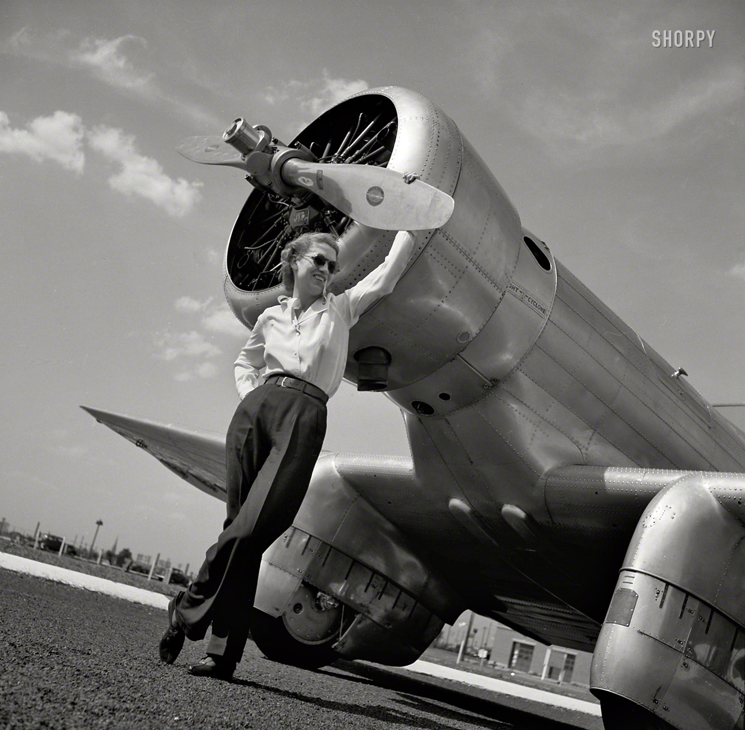 August 1939. "Pilot Jacqueline Cochran and Northrop 'Gamma' racing plane." Medium format negative by Toni Frissell for Vogue. View full size.