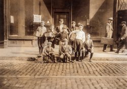 October 1909. "A Group of Boot-Blacks in Bowdoin Square, a Passing Juvenile Industry. Location: Boston, Massachusetts." Photograph by Lewis Wickes Hine. View full size.