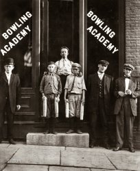 September 1910. Burlington, Vermont. "Two of the 'pin boys' working in Bowling Academy with three other small boys until 10 or 11 p.m. some nights." One of our astute commenters noticed this place just two doors over from the hotel seen here, and made the connection to Lewis Hine, who took this photo, as well as the pictures of Shorpy.com's namesake coal miner. View full size.