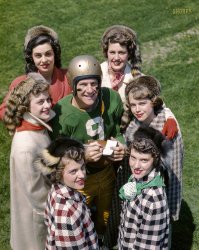 May 1950. "University of Notre Dame football quarterback Bob Williams posed as if signing autographs for a group of college women." 3x4 inch Kodachrome transparency by Frank Bauman for the Look magazine assignment "Grantland Rice's Football Forecast for 1950." View full size.