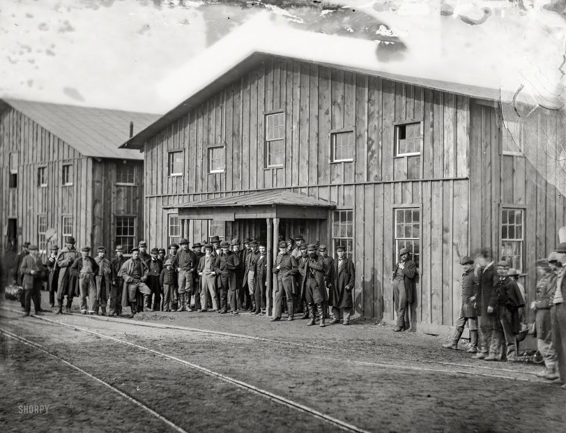 February 1863. "Aquia Creek Landing, Virginia. Personnel in front of Quartermaster's Office. Photograph from the main Eastern theater of war, Burnside and Hooker, November 1862-April 1863." Wet plate glass negative by Alexander Gardner. View full size.
